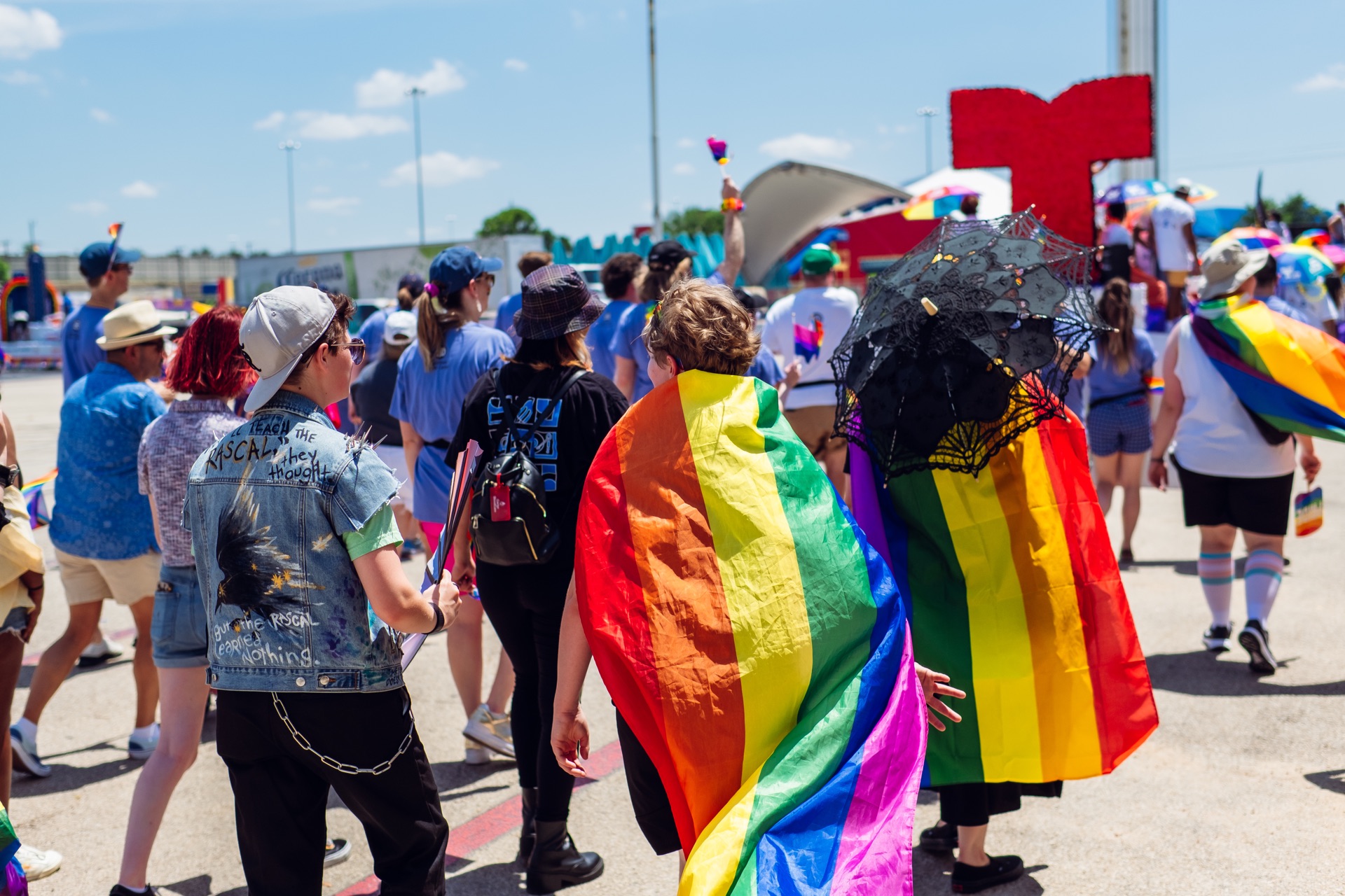 UTD Marchers Wearing Rainbow Capes at the Dallas Pride Parade